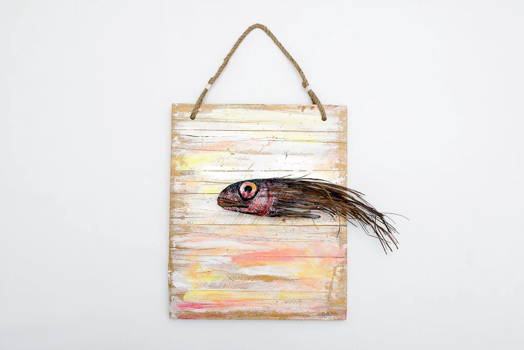 Unique Sunderland fish sculpture made from a natural palm leaf on reclaimed wood by Mario Diaz Art.
